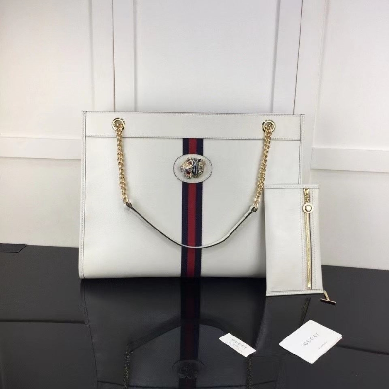 G*u*i shopping bags